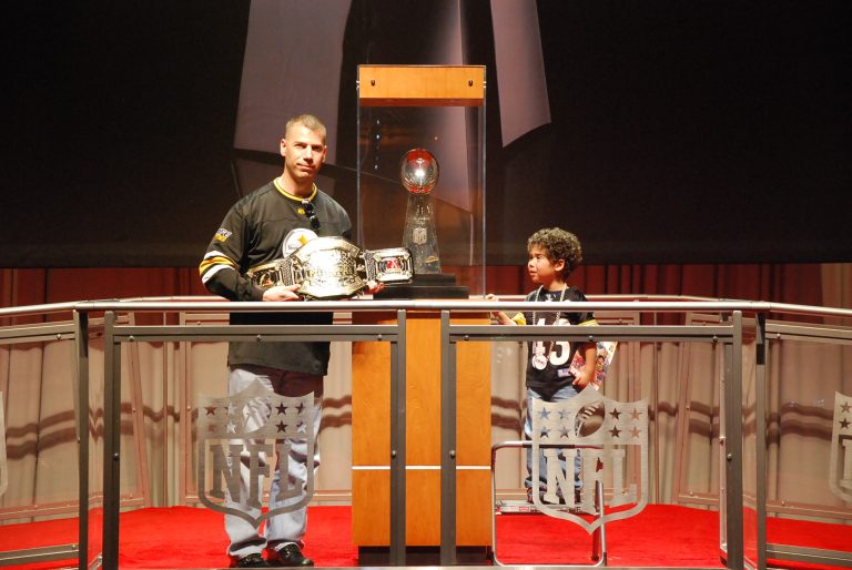 Two of the most photgraphed trophies at the Super Bowl Expo