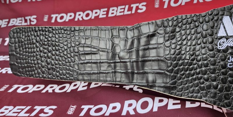 Reverse of the MVP women's belt showing black crocodile-embossed leather backing