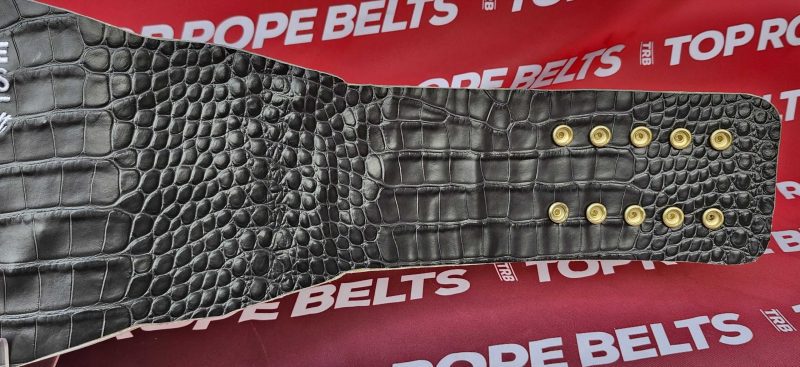 Back of the MVP women's championship belt, black croc-embossed leather with gold snaps